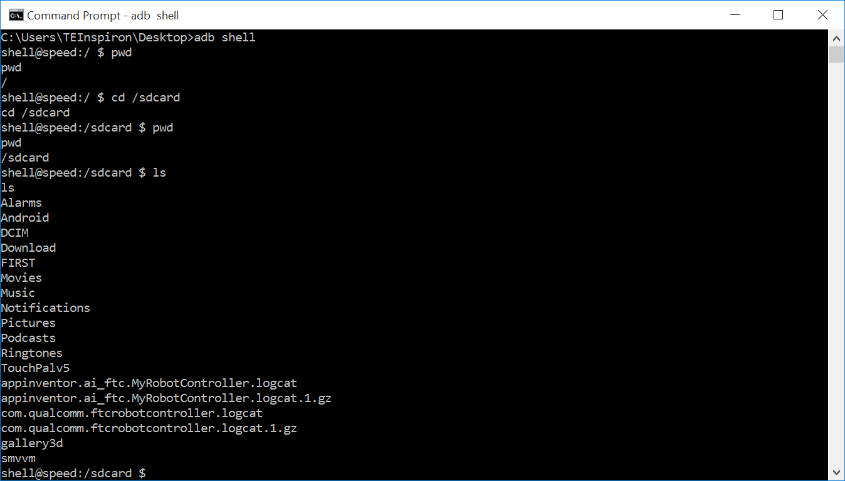 ADB shell ls output listing folders and log files in the /sdcard directory.