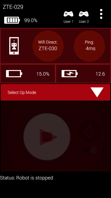 Driver Station app screen showing the connected device name, Wi-Fi Direct ping time, battery percentages, and a Status of Robot is stopped.