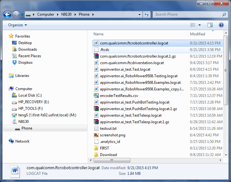 Windows File Explorer window browsing an Android phone's storage, listing log files including com.qualcomm.ftcrobotcontroller.logcat.