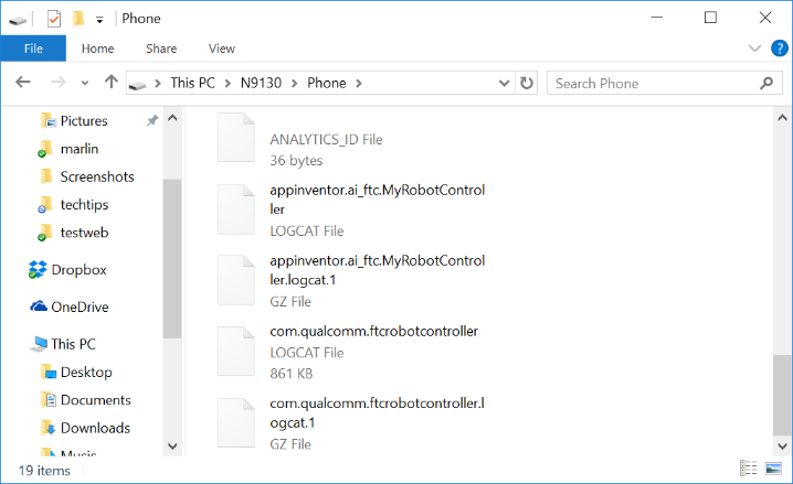File Explorer listing showing the com.qualcomm.ftcrobotcontroller LOGCAT file among other files in the phone's storage.