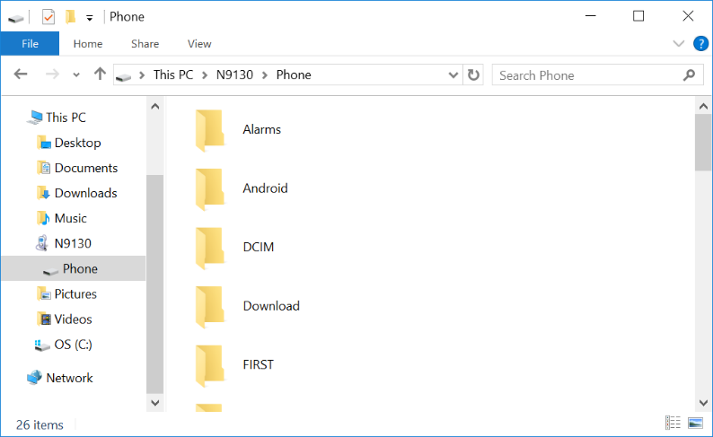 Phone's main storage directory in File Explorer listing folders including Alarms, Android, DCIM, and FIRST.