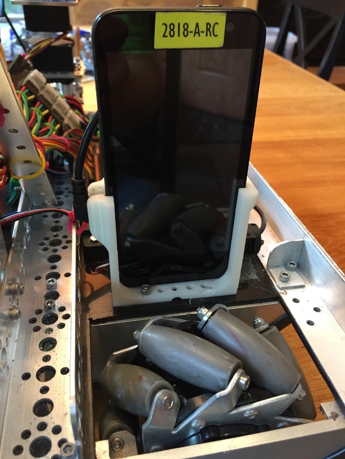 A Robot Controller phone held in a white 3D-printed mount attached to the robot frame.